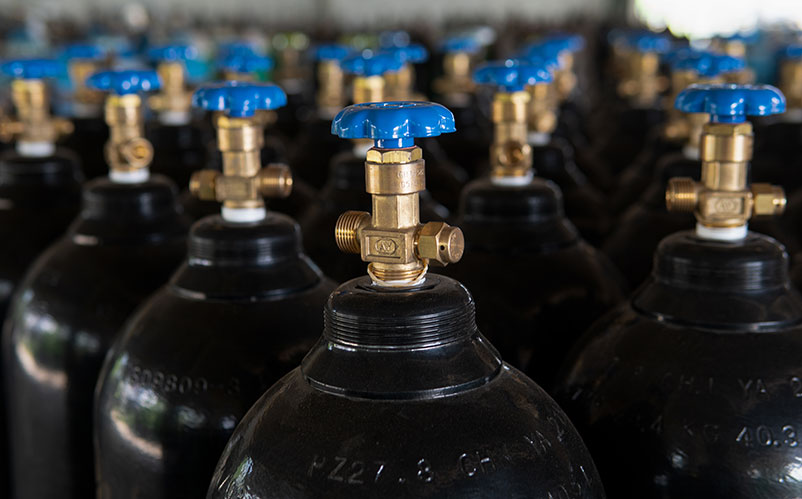 Gas cylinders with pressure regulators and gauges